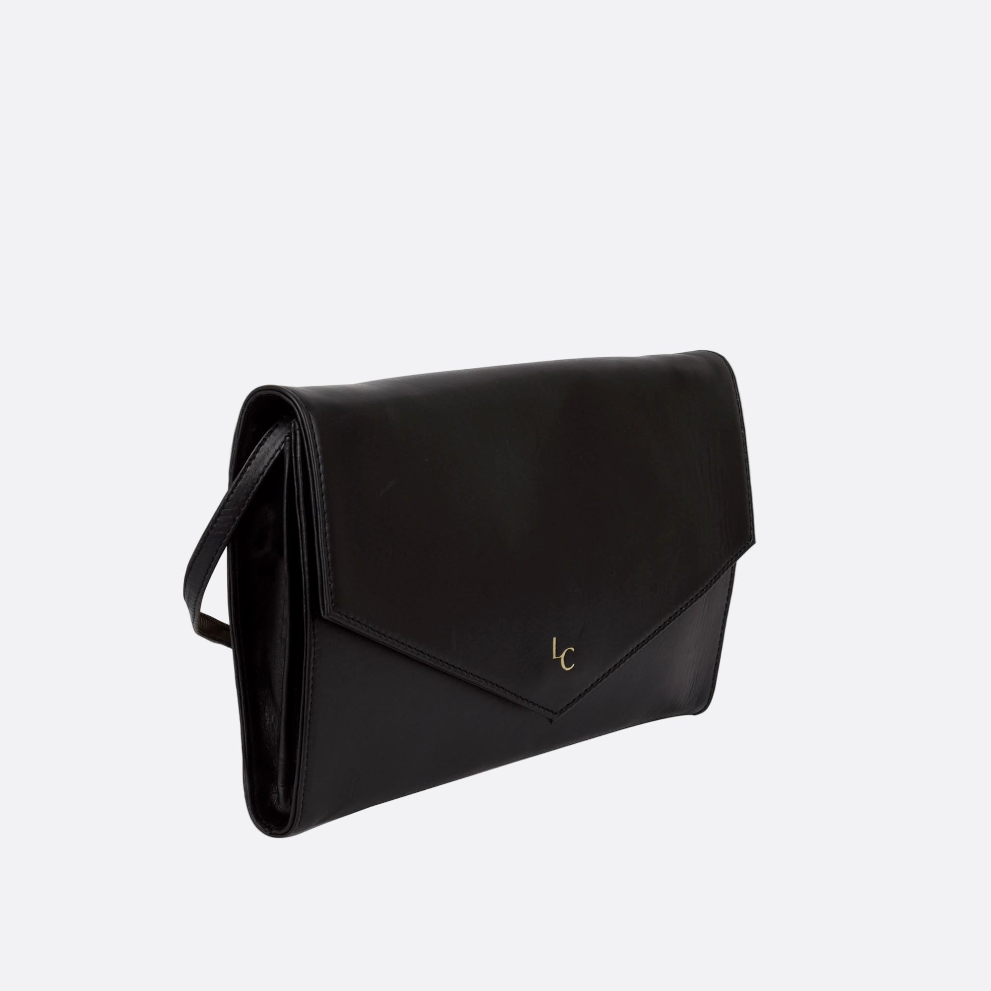 Side view of slim AFTON black clutch in soft leather