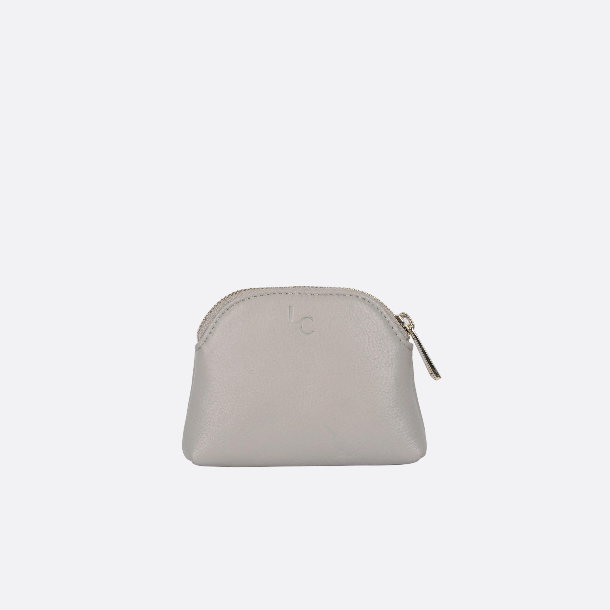 Back view of LILLA-S beige leather dome purse with curved silhouette