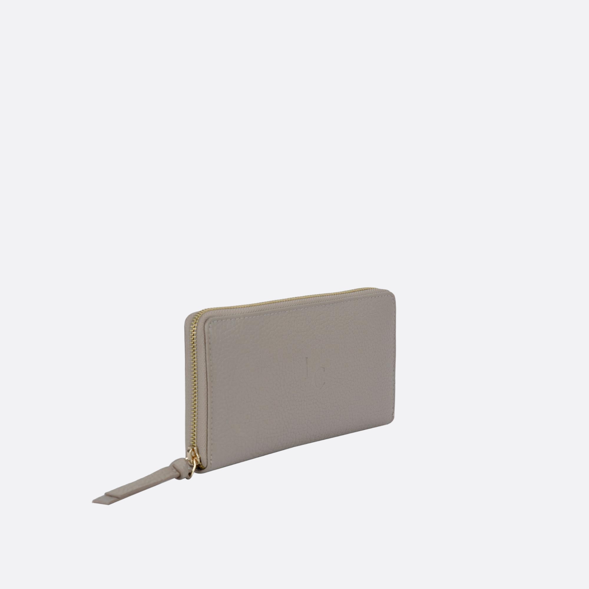 Side angle of MYNT large beige leather wallet showing slim profile and zip closure