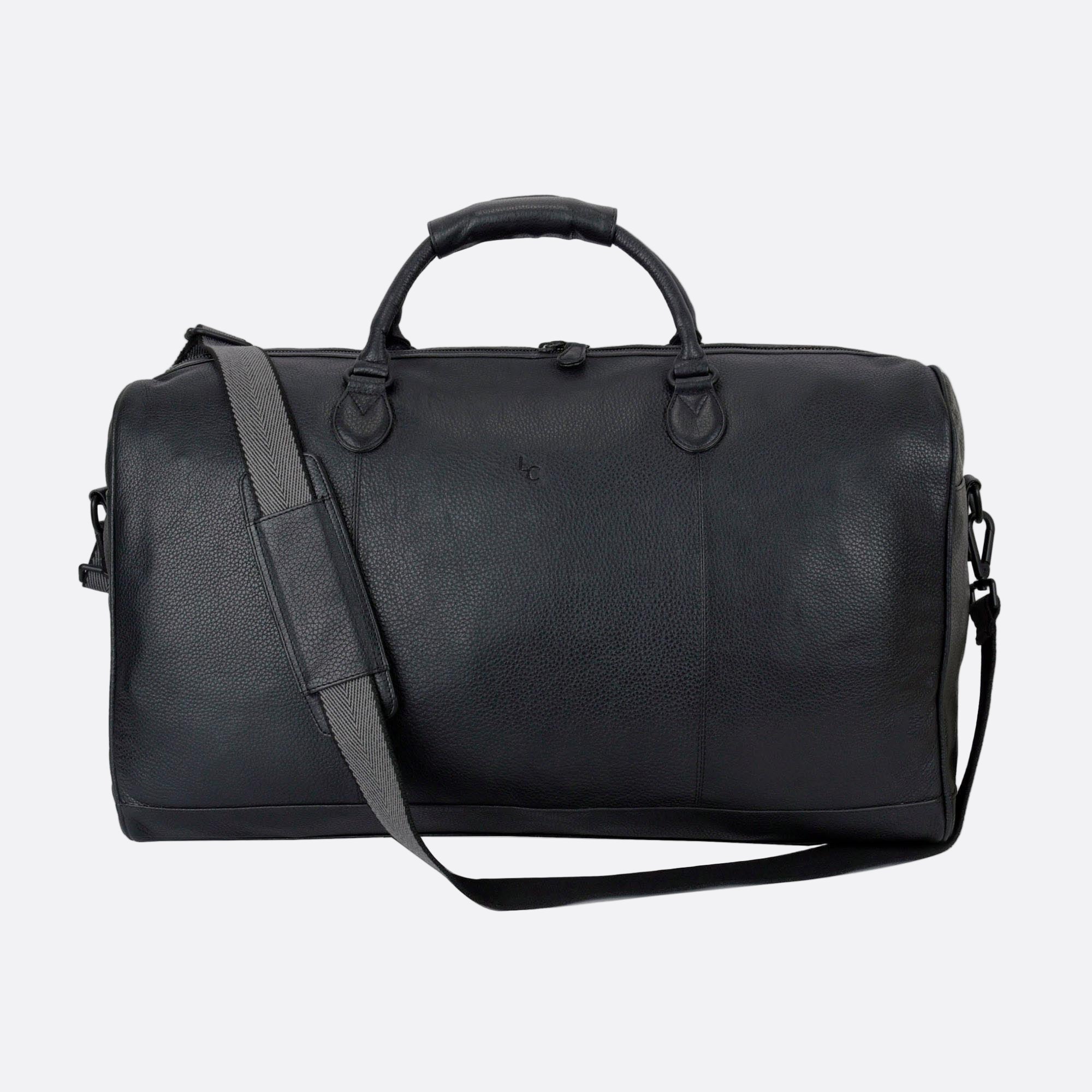 Back view of OLLE black leather duffel bag with soft structure and webbed removable and adjustable shoulder strap