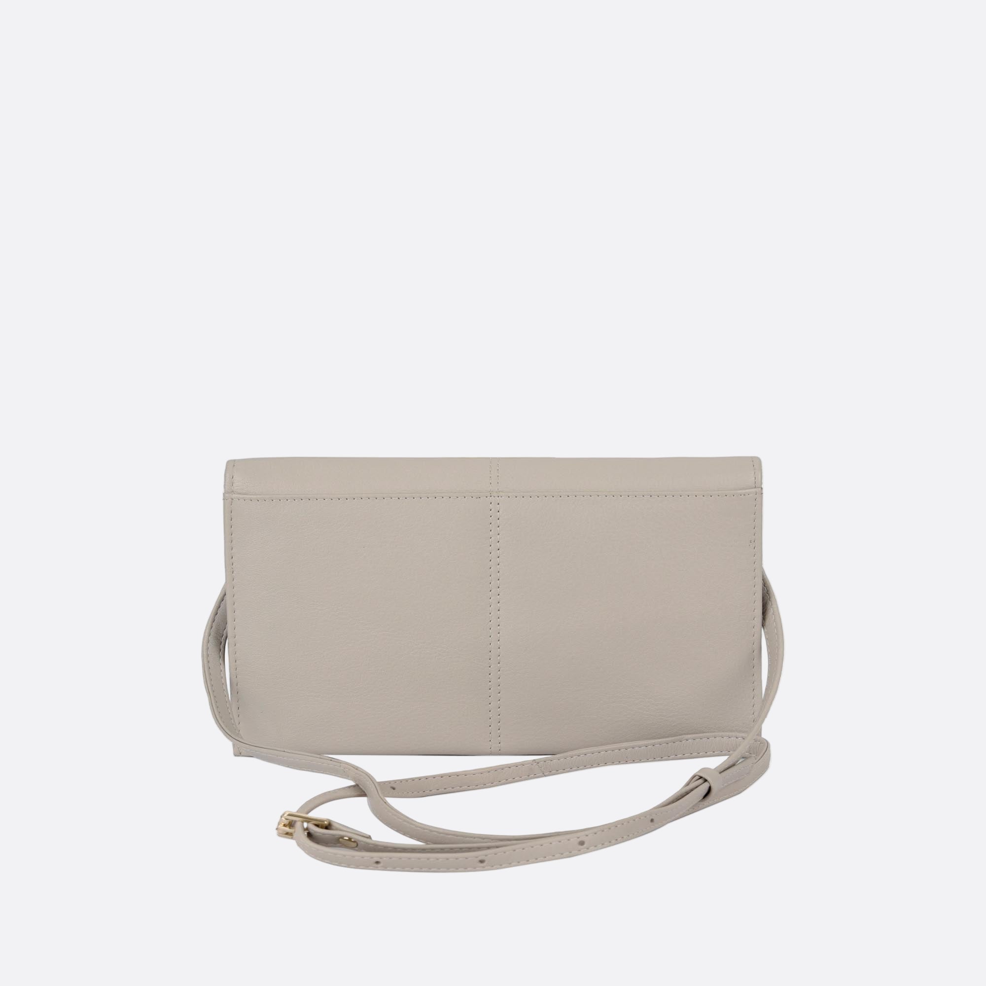 Back view of SOMMARLOV beige leather crossbody clutch with slim silhouette and adjustable and removable slim leather strap