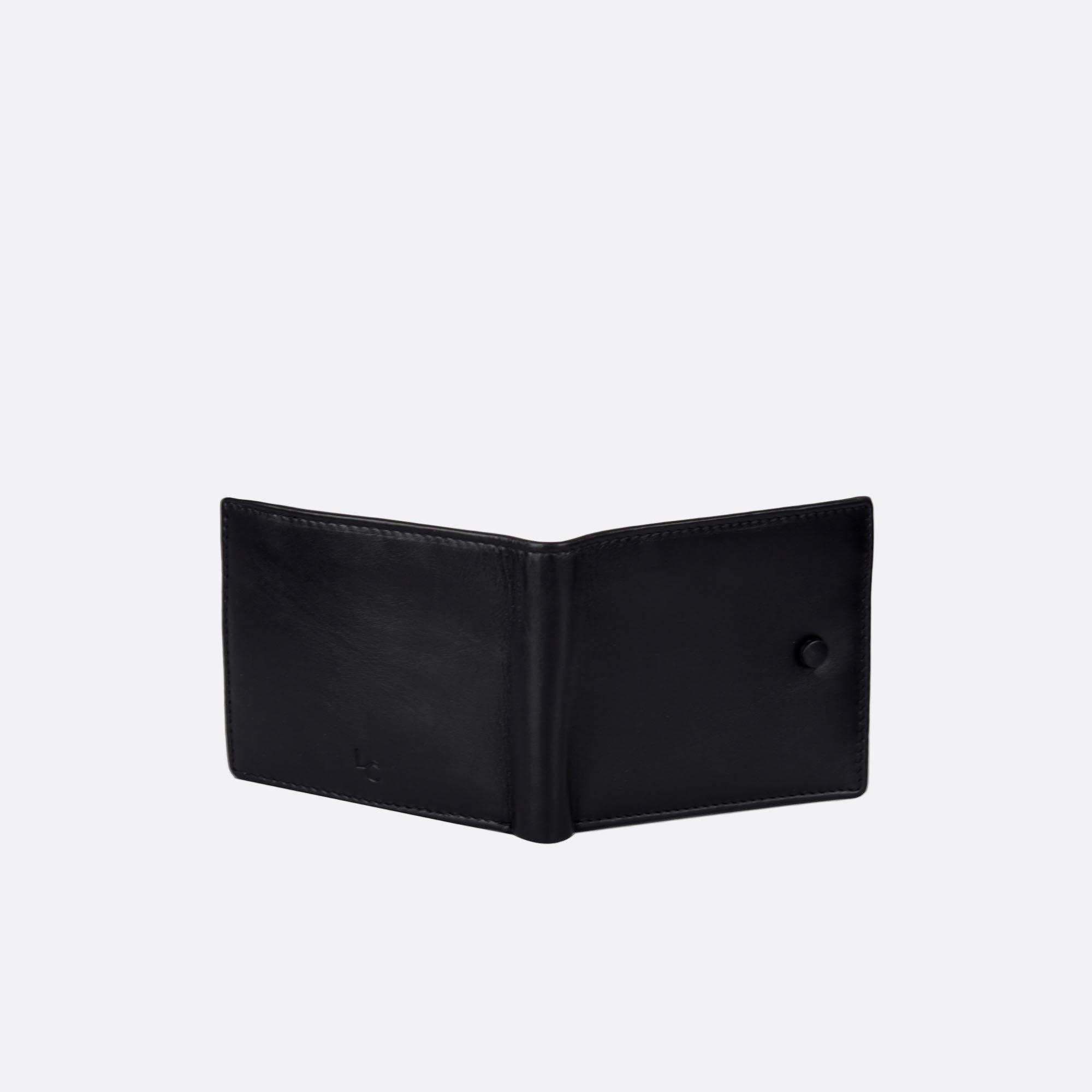 Open back of KNAPP black leather wallet with black button detail
