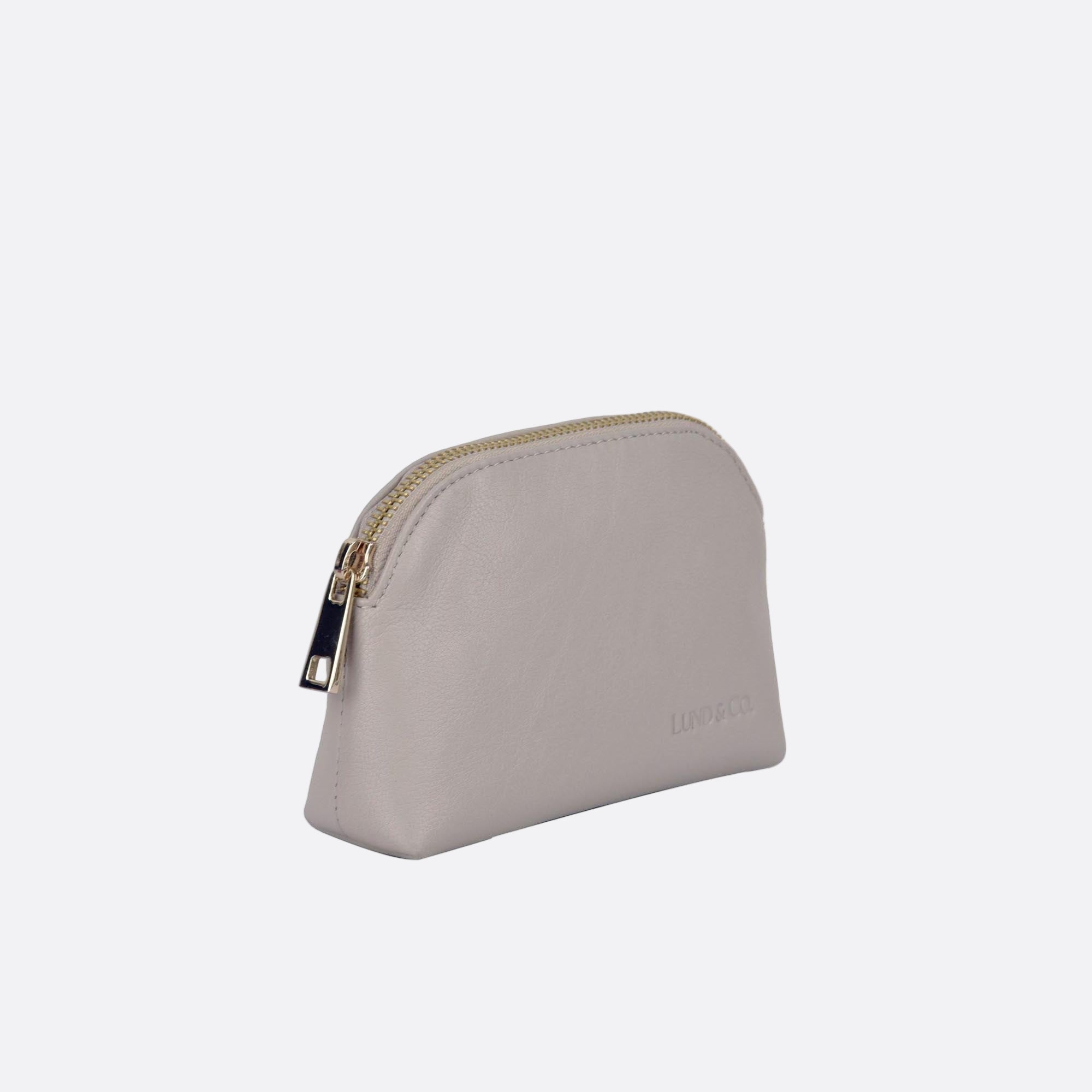 Side angle showing LILLA-L beige leather purse’s structure and stitching detail
