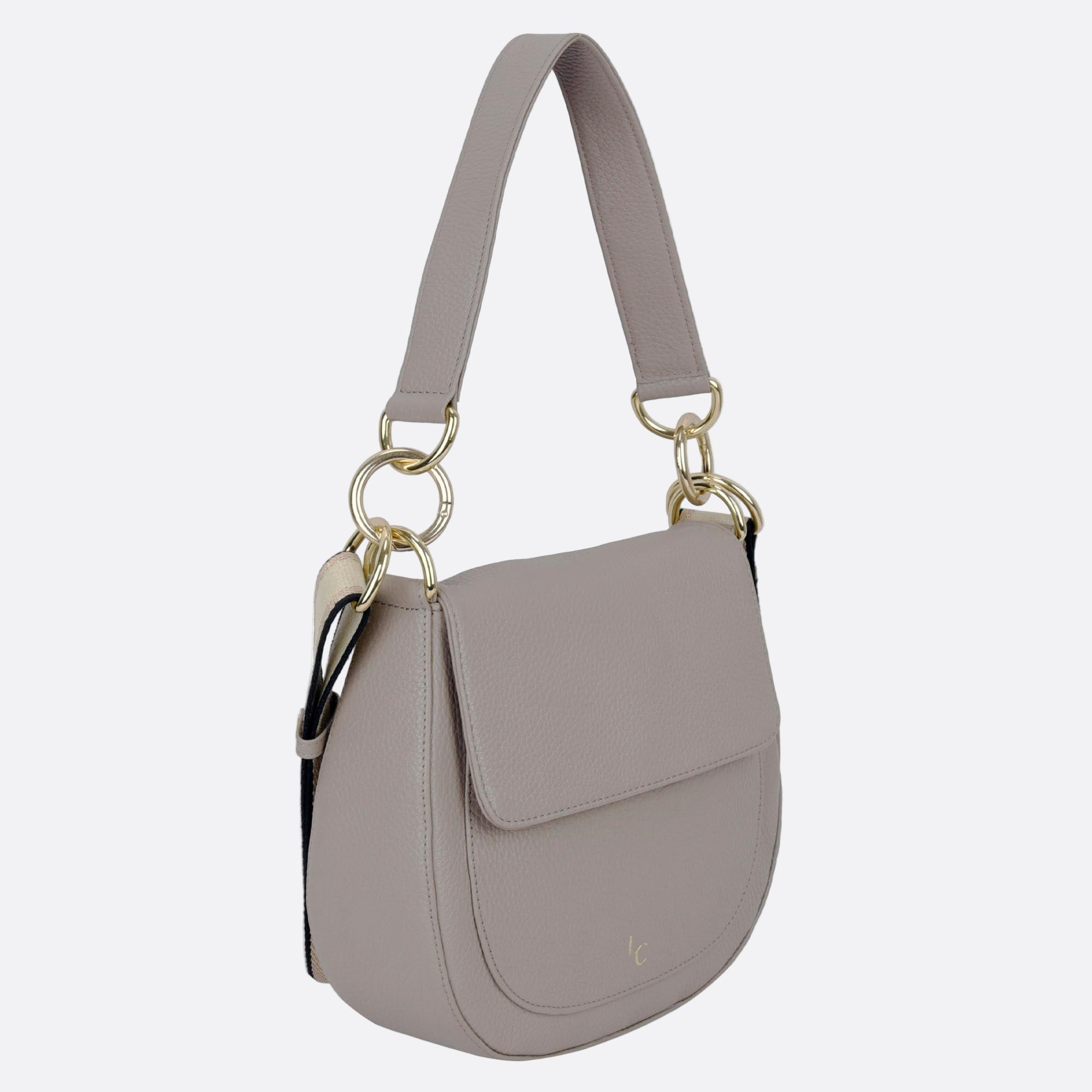 Side angle of NALLE beige leather crossbody shoulder bag showing depth and curved edges