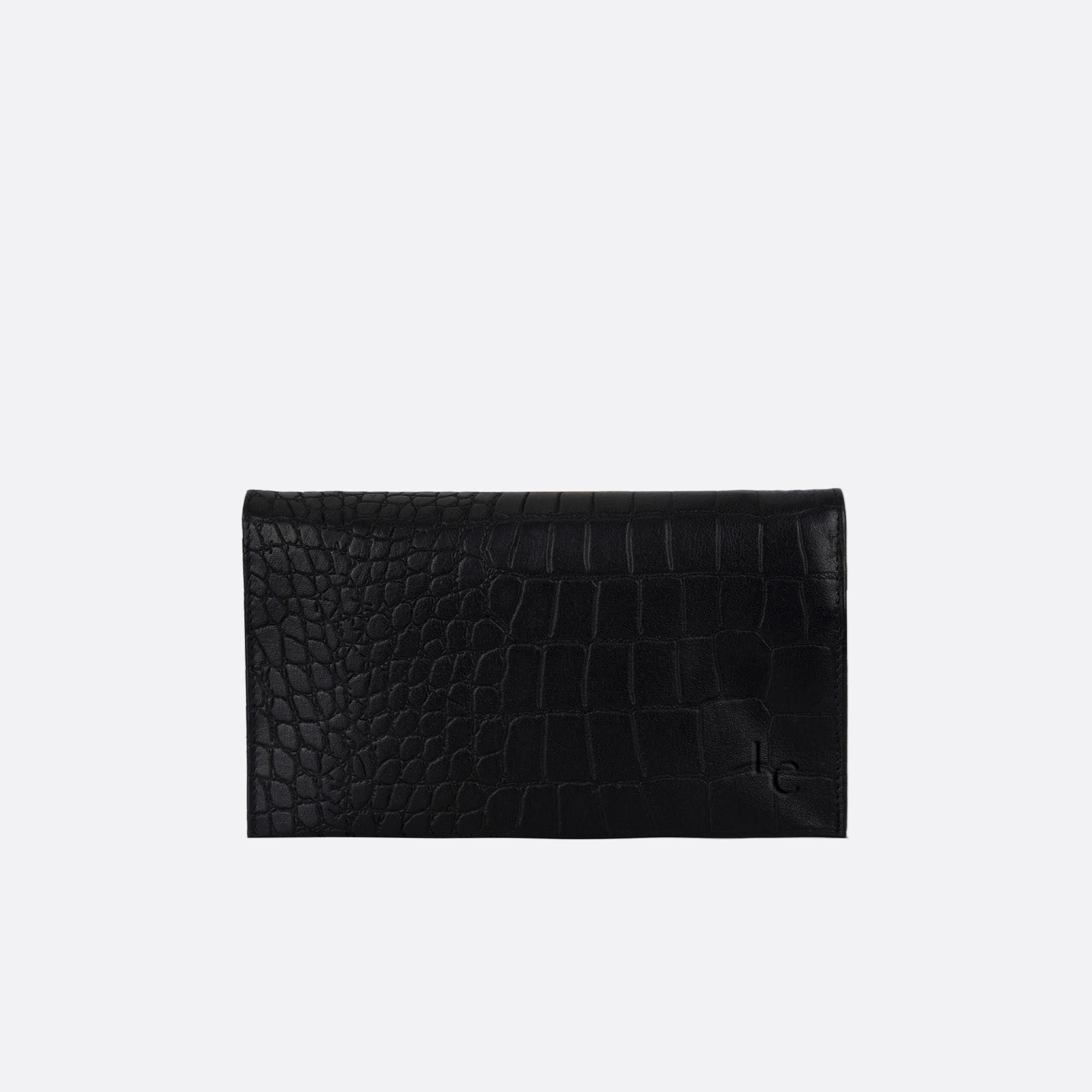 Front view of SOMMARLOV black Croc leather crossbody clutch with slim silhouette